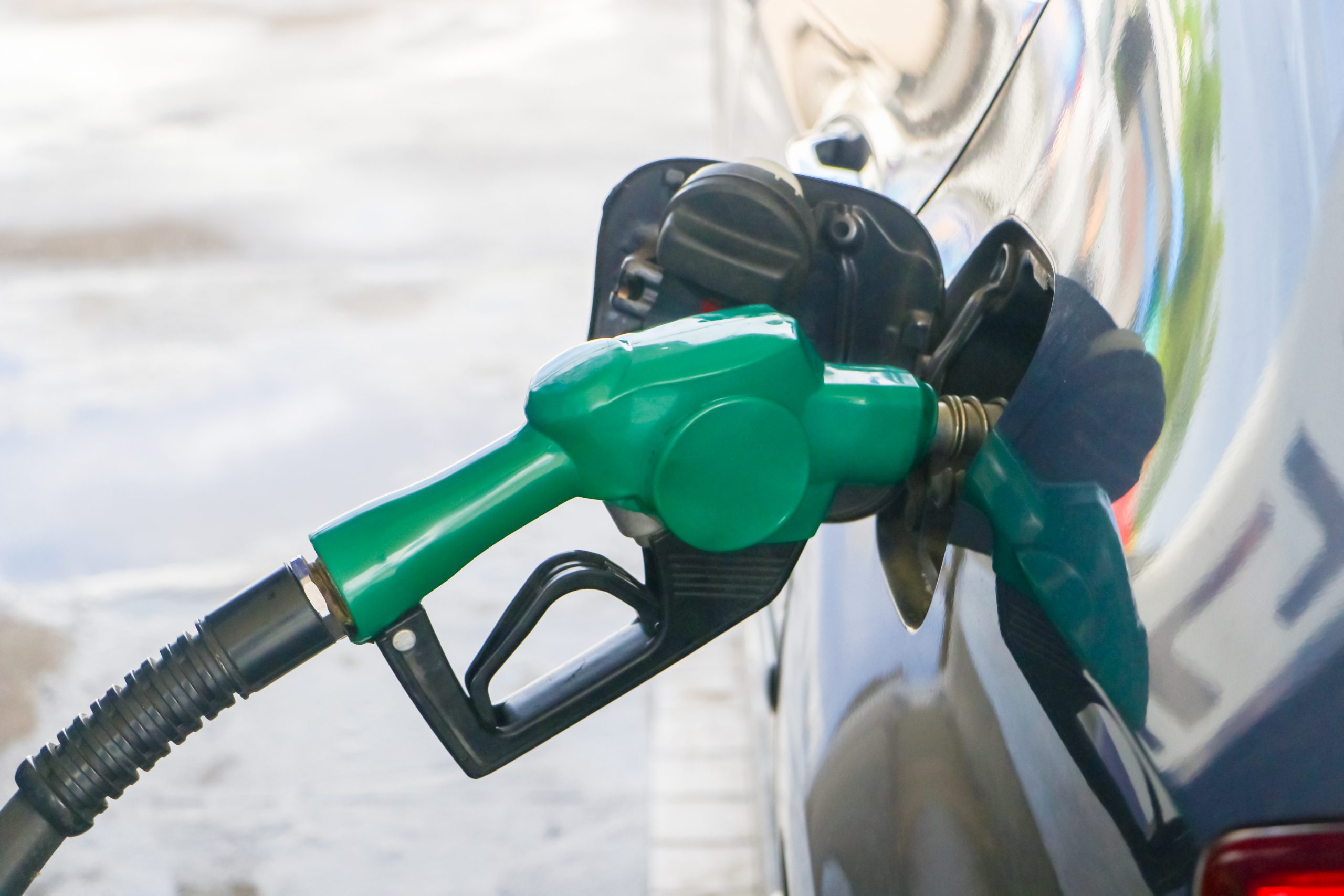 Gas,Station.,Fuel,Pump.colorful,Petrol,Pump,Filling,Nozzles. Car being filled up with petrol