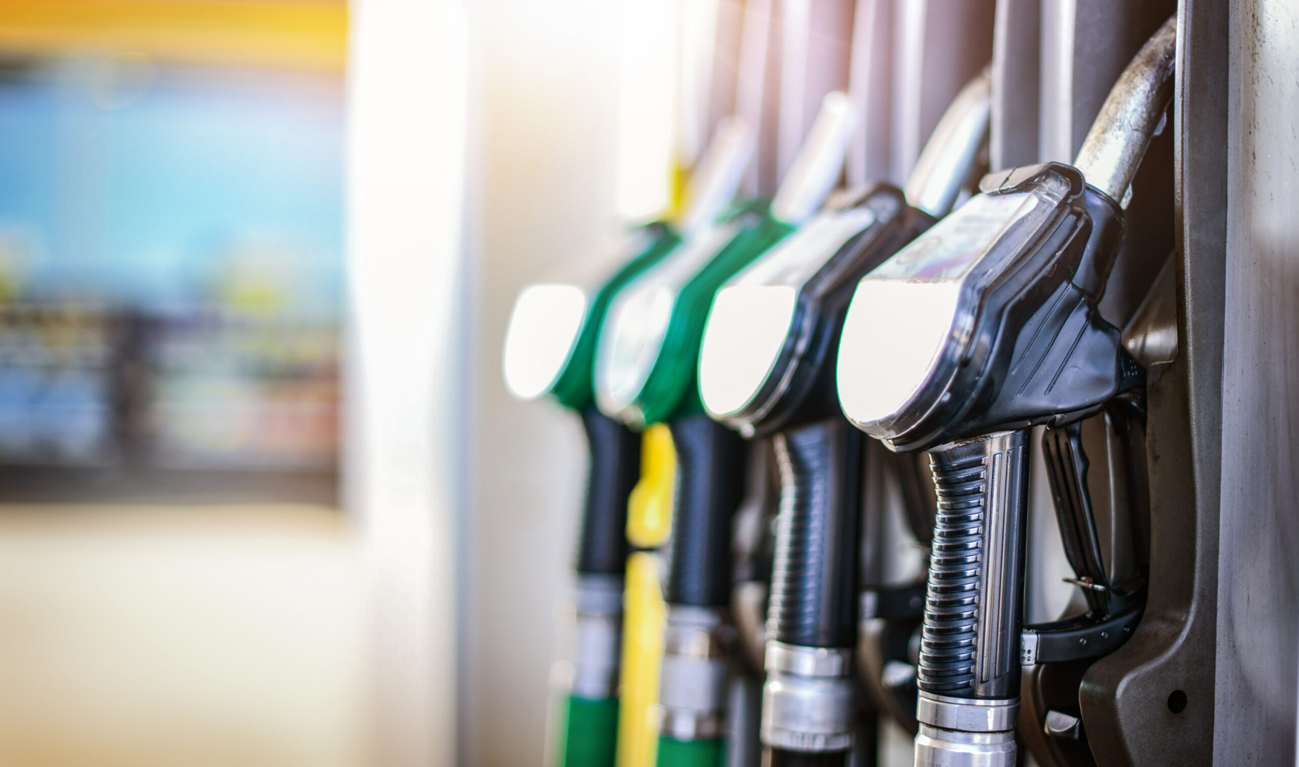 Colorfull fuel gasoline dispenser background. Fuel pumps station April UK Fuel Market Update